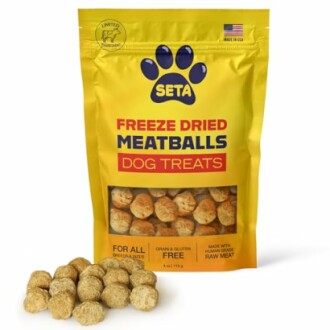 Bag of freeze dried meatballs dog treats with some treats in front.